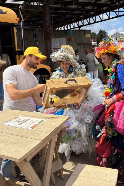 Mobile educational beehive box shown at a community event